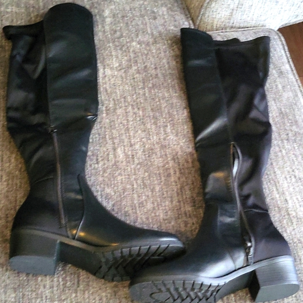 Women brand new never worn over the knee black boots.